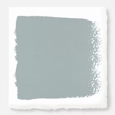 a light gray color with some white spots on it