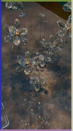 some clear glass flowers on a table