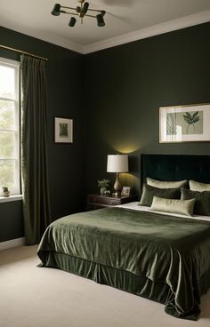 a bedroom with dark green walls and white carpeted flooring is pictured in this image