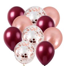 a bunch of balloons that are in the shape of polka dots on white and pink