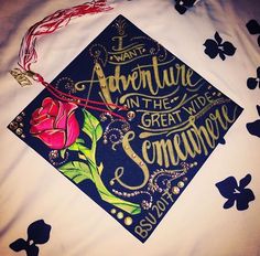 a graduation cap with the words adventure in the great wide somewhere on it and a rose