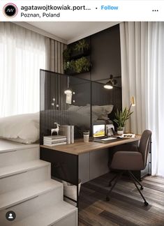 a desk with a computer on top of it next to some stairs and potted plants