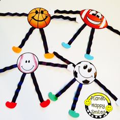 a group of hand puppets made to look like people holding basketballs and smiling faces