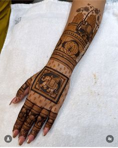 a woman's hand is decorated with intricate designs