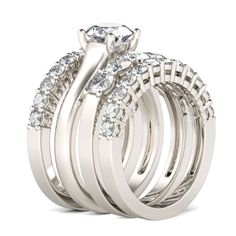 a wedding ring set with three rows of diamonds on top of each other, and an oval