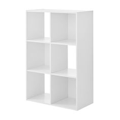 a white bookcase with four shelves on each side