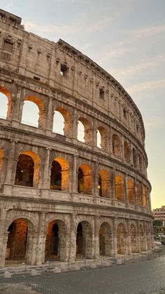 the roman colossion is lit up at night