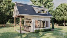 a small house with a covered porch and an outdoor kitchen area in the front yard