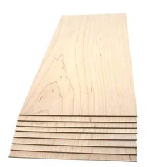 several pieces of plywood are stacked on top of each other in front of a white background