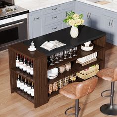 a kitchen island with wine bottles and glasses on it