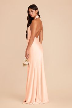 the back of a bridesmaid's dress in peach