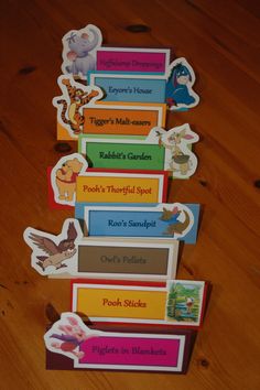 the winnie the pooh bookmarks are stacked on top of each other in order to be read