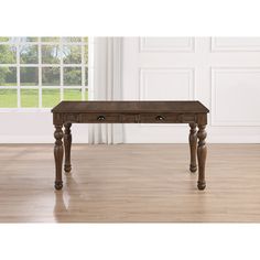 a wooden table sitting on top of a hard wood floor