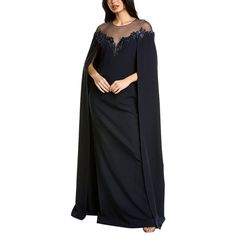 About The Brand: Gowns And Cocktails For That Special Night. Cape Gown In Navy With Crepe Design, Tulle Illusion Neckline, And Beaded Trim Approximately 62in From Shoulder To Hem Model Is 5'9.5 And Is Wearing A Size 4. Measurements May Vary Slightly By Size. Center Back Zipper With Hook-And-Eye Closure Keyhole Button Closure Shell: 87% Polyester, 13% Spandex Lining: 100% Polyester Dry Clean Only Imported Sheer Floor-length Evening Gown, Sheer Mother Of The Bride Dress For Evening, Floor-length Evening Gown With Sheer Sleeves, Floor-length Gown With Sheer Sleeves For Evening, Elegant Blue Gown With Cape Sleeves, Formal Mother Of The Bride Dress With Cape Sleeves, Evening Gown With Sheer Sleeves, Sheer Floor-length Formal Gown, Formal Sheer Floor-length Gown