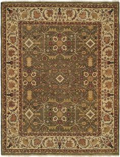 a rug with an intricate design on the center and sides in green, beige and brown colors