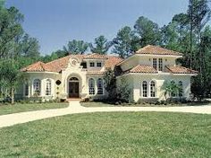 this is an image of a beautiful house in the daytime time with lots of windows