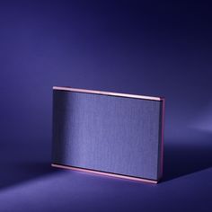 a purple box sitting on top of a blue surface