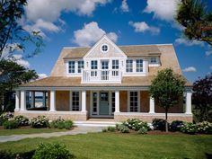 a large house with white trim and windows