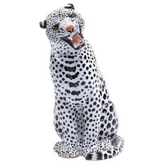 a white and black dalmatian figurine sitting down