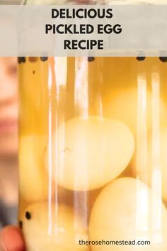 a person holding a jar full of pickled egg in front of the camera with text overlay that reads delicious pickled egg recipe