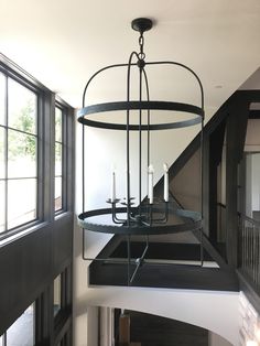 a chandelier hanging from the ceiling in a house