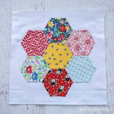 the hexagons are all different colors and patterns on this piece of fabric