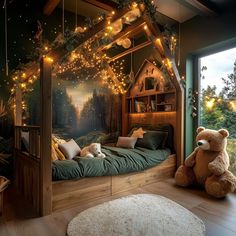 a teddy bear sitting on the floor in front of a bed with lights hanging from it