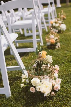 the wedding ceremony is decorated with white chairs and flowers