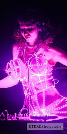 a woman in a dress with lights on her body