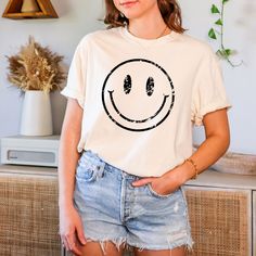 "This Distressed Smile Face comfort colors shirt is the most thoughtful way to show appreciation for your friends and family on any occasion. How To Order  1. Kindly check and review all photos for your reference. 2. Choose your t-shirt size. 3. Choose your t-shirt color 4. Click add to cart when done. 5. If you need more than 1 shirt, please go back and add more. 6. Click \"Proceed to check out.\" 7. If you have any questions, please contact us. 8. Enjoy your item! 🙌Our Appreciation 🙌 We want Relaxed Fit Graphic Tee Shirt For Birthday, Graphic Tee Shirt With Relaxed Fit For Birthday, Casual Relaxed Fit Top For Birthday, Birthday Graphic Tee Shirt With Relaxed Fit, Casual Birthday Shirt With Crew Neck, Casual Crew Neck Shirt For Birthday, Casual Crew Neck Birthday Shirt, Relaxed Fit T-shirt With Smiley Face, Casual Smiley Face T-shirt