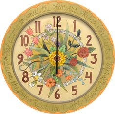 an ornate clock with flowers painted on it's face and numbers in the middle