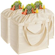 two bags with carrots and broccoli in them sitting next to each other