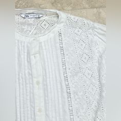 Very Beautiful And Delicate Blouse It Has Very Fine Sparkle Lines You Can Dress It Up Or Dress It Down It’s A Little Cropped Casual Broderie Anglaise Shirt For Daywear, Summer Daywear Shirt With Broderie Anglaise, Summer Broderie Anglaise Shirt For Daywear, Zara White Tops With Broderie Anglaise, Zara White Broderie Anglaise Tops, Casual White Blouse With Broderie Anglaise, Zara Casual Lace Top Blouse, Casual Zara Blouse With Lace Top, Zara Lace Top Blouse For Summer