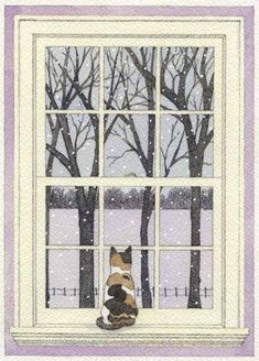 a cat sitting on the window sill looking out at trees and snow covered ground