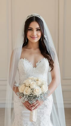 a woman in a wedding dress holding a bouquet