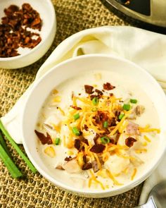 two bowls filled with soup sitting on top of a table