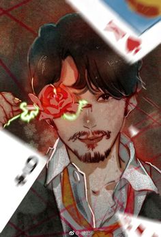 a man with a rose in his hair and an eye patch on his forehead is surrounded by playing cards