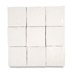 several square white tiles arranged on top of each other