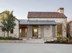 a large house with an entry way leading to the front door