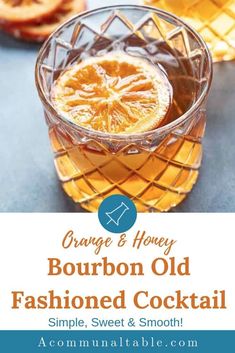 an orange and honey bourbon old fashioned cocktail in a glass with the words, orange & honey bourbon old fashioned cocktail