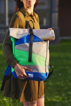 Discover our Eco-Friendly Color Block Roll Top Backpack, a perfect blend of style and sustainability. This eye-catching backpack features vibrant color blocks of green, blue, and beige, making it a standout accessory for any occasion. Crafted from upcycled Oxford material, this backpack is designed to be both durable and environmentally friendly. The roll-top closure ensures your belongings stay secure, while the high-quality YKK zippers provide smooth and reliable access. With a spacious main c Green Urban Backpack For Everyday Use, Urban Green Backpack For Everyday Use, Modern Green Backpack, Green Commuting Backpack With Adjustable Strap, Recyclable Backpack For Outdoor Use, Modern Green Backpack For Outdoor Use, Modern Green Backpack For Outdoor, Modern Multicolor Backpack For Everyday Use, Modern Green Bags For Outdoor