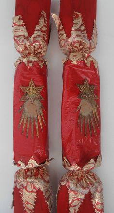 two red bags with gold decorations on them