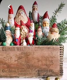 a wooden box filled with christmas gnome figurines