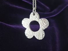 This beautiful simple flower design was hand carved by me in jewellers wax then was cast in solid sterling silver. This pendant was never moulded which makes this piece a one of a kind. The flower itself measures approximately 36mm in diameter and is lightly hammer textured on both sides. Flower-shaped Polished Jewelry Gift, Flower Shaped Polished Finish Jewelry As Gift, Flower Shaped Jewelry With Polished Finish For Gift, Flower Shaped Polished Finish Jewelry For Gift, Silver Flower-shaped Jewelry With Polished Finish, Silver Flower Jewelry With Polished Finish, Silver Flower Necklace For Anniversary, Handmade Silver Flower-shaped Necklace, Handmade Sterling Silver Flower Necklace