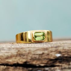 Natural Peridot Men's Ring, Solitaire Engagement Ring, 18k Gold Plated Ring, Emerald Cut Signet Ring, Weeding Ring, Anniversary Gift For Him 》D E T A I L S《 Gemstone: 1) Natural Peridot Gem Color: 1) Green Gem Shape: 1) Emerald  Gem Category: Cut Metal: 925 Sterling Silver Purity: 925 Parts Per 1000 Setting Type: Bezel Set Silver Polish: High Ring Size: All Size Available Please note that there Can be slight variations in stone texture and color shades in the actual product that you receive. The Peridot Emerald Ring, Ring Emerald Cut, Green Gem, Anniversary Gift For Him, Emerald Gem, Silver Polish, Ring Emerald, Green Gems, Stone Texture