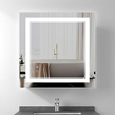 a bathroom sink with a mirror above it