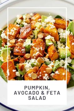 a white plate topped with a salad covered in nuts and avocado next to the words pumpkin, avocado & feta salad