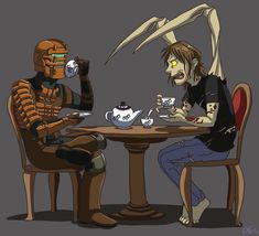 two people sitting at a table with tea cups in front of them, one wearing a robot costume