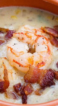 a bowl of soup with shrimp and bacon