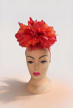 One of a kind, beautiful Fascinator Hat headband. This features a firey red orange dahlia flower.  It is very large and stunning.  The photos don't really do it justice very beautiful in person.  Perfect for weddings or to wear to the Kentucky Derby.    Our sweater crew love to display their talents on other things other than sweaters, this is just one example. You can show this off at any event, or just out for coffee. Red Spring Headband, Summer Flower Headpiece With Matching Headband, Red Headband For Spring, Adjustable Red Headband For Spring, Red Headband Hair Accessories For Spring, Red Adjustable Fascinator For Garden Party, Adjustable Red Fascinator For Garden Party, Red Summer Fascinator With Handmade Flowers, Red Fascinator For Spring Garden Party